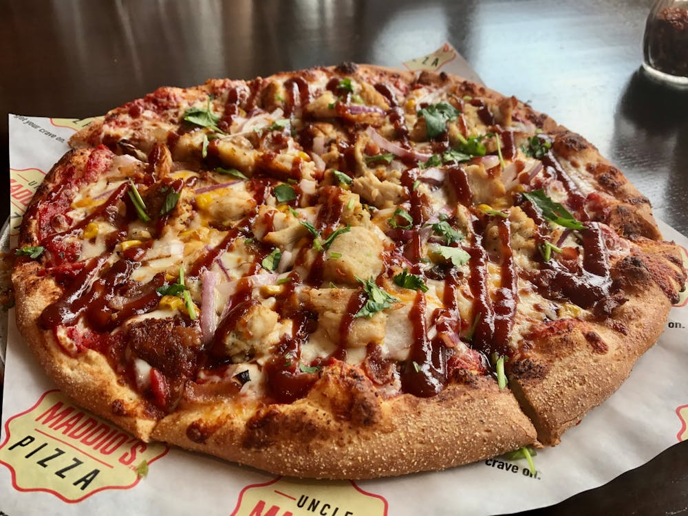 Close-up shot of a topping-rich and flavor-heavy meat pizza.
