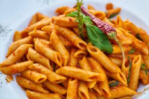 Close-up shot of spicy penne pasta.